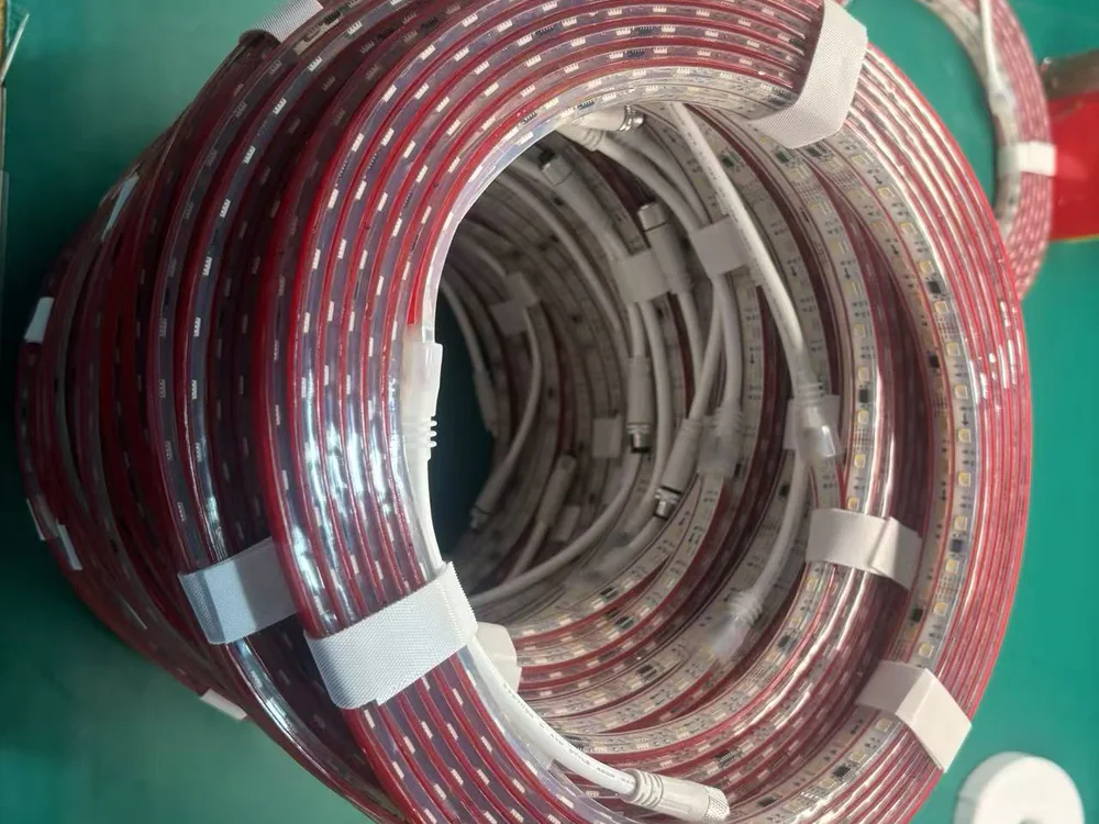 Clear flexible LED silicone sleeve coils on a workbench