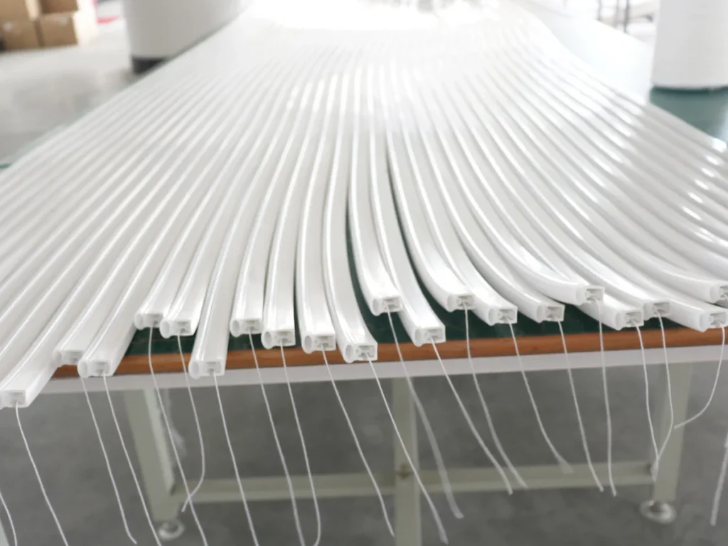 Rows of white extruded lighting profiles with visible cross-sections