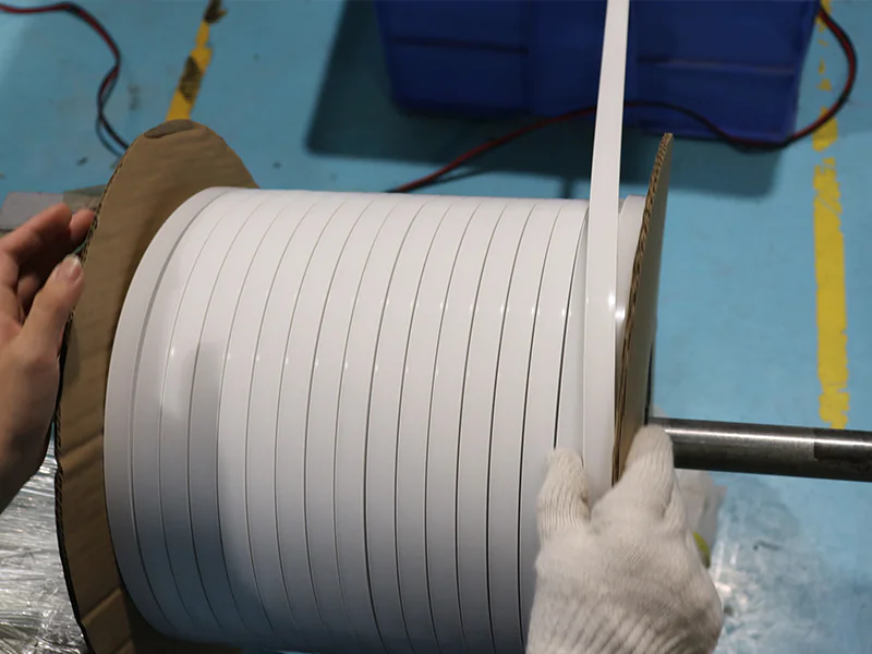 White silicone lighting profile being wound onto a reel