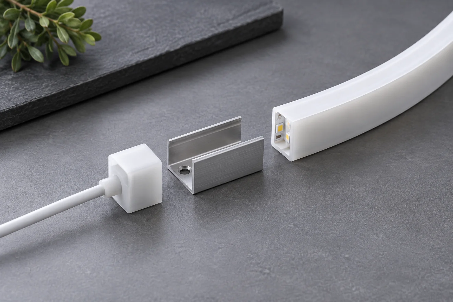 End cap, mounting clip and cable exit arranged with a silicone lighting profile