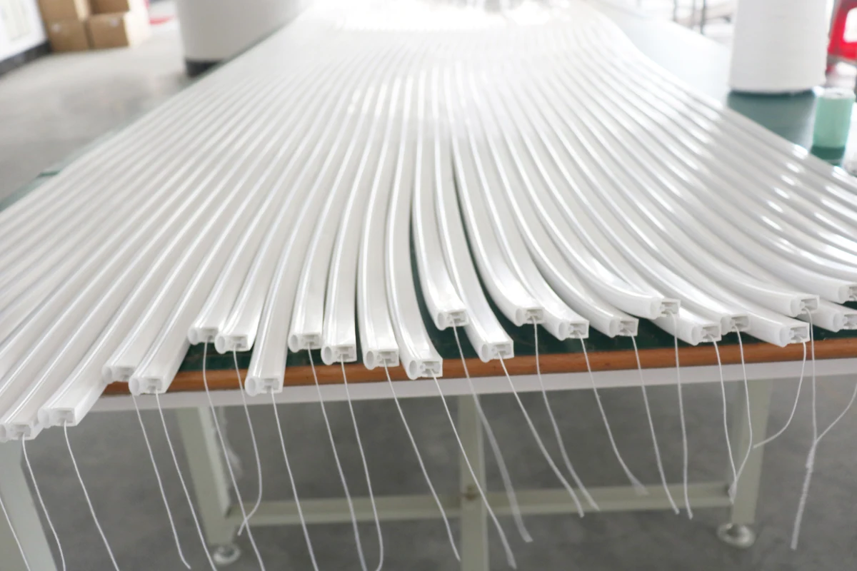 Silicone lighting profiles with visible cross-sections and cable exits prepared for installation review