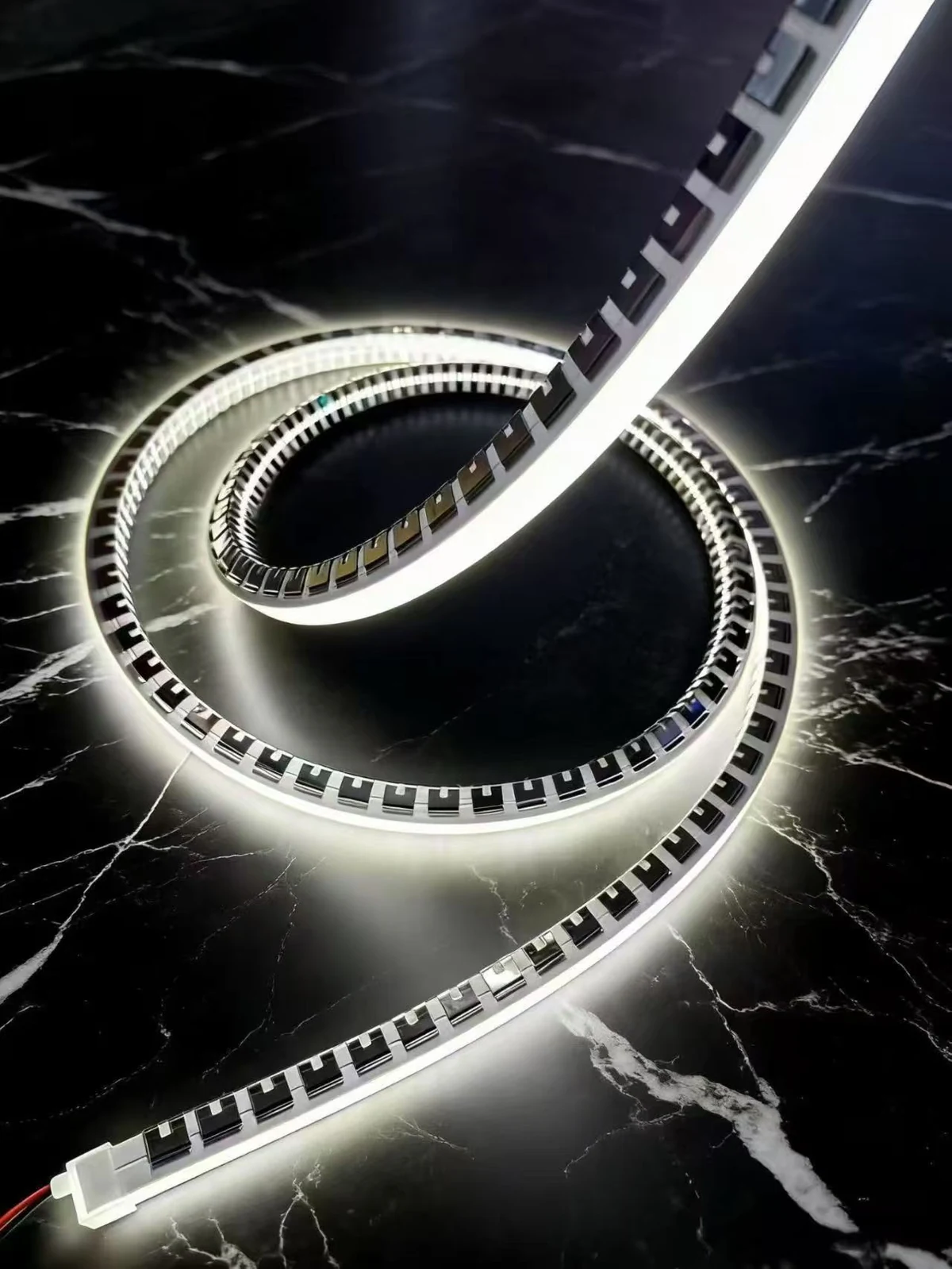 Illuminated flexible linear lighting showing a continuous white light appearance