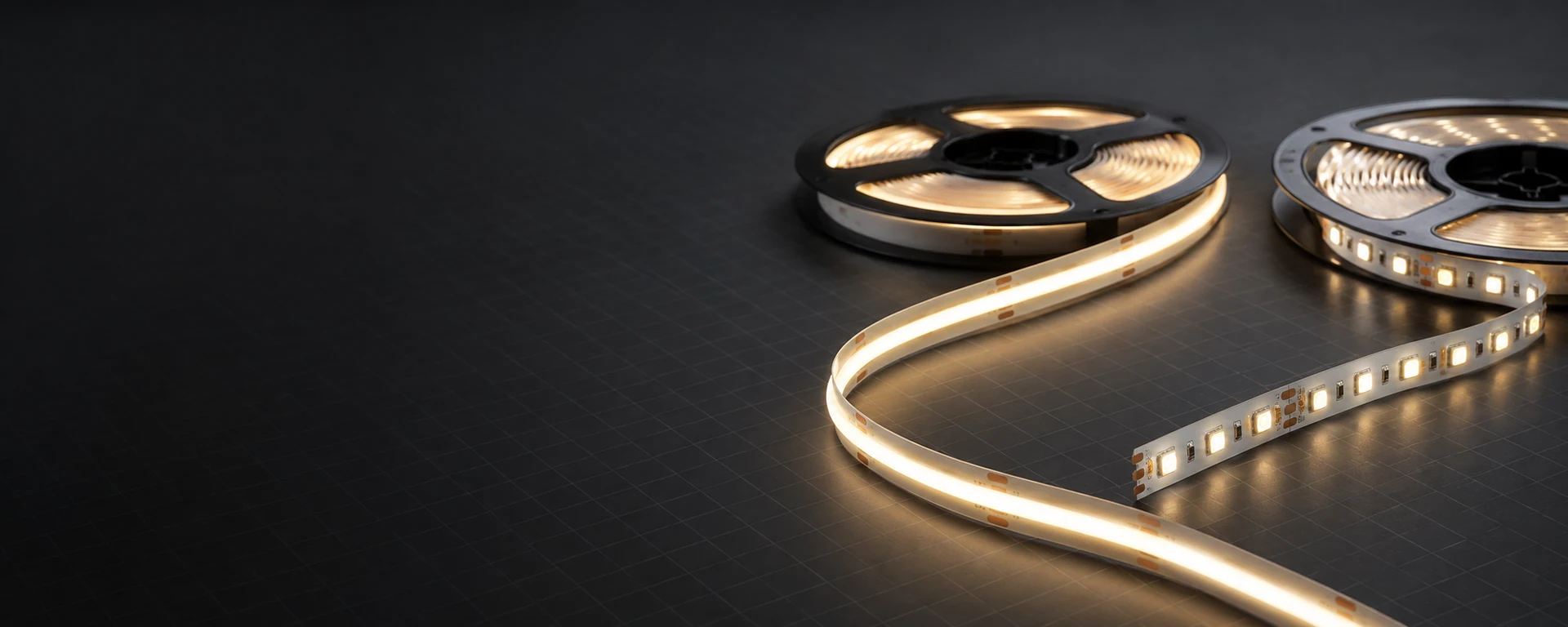 COB and SMD LED strip lights arranged on a dark technical surface
