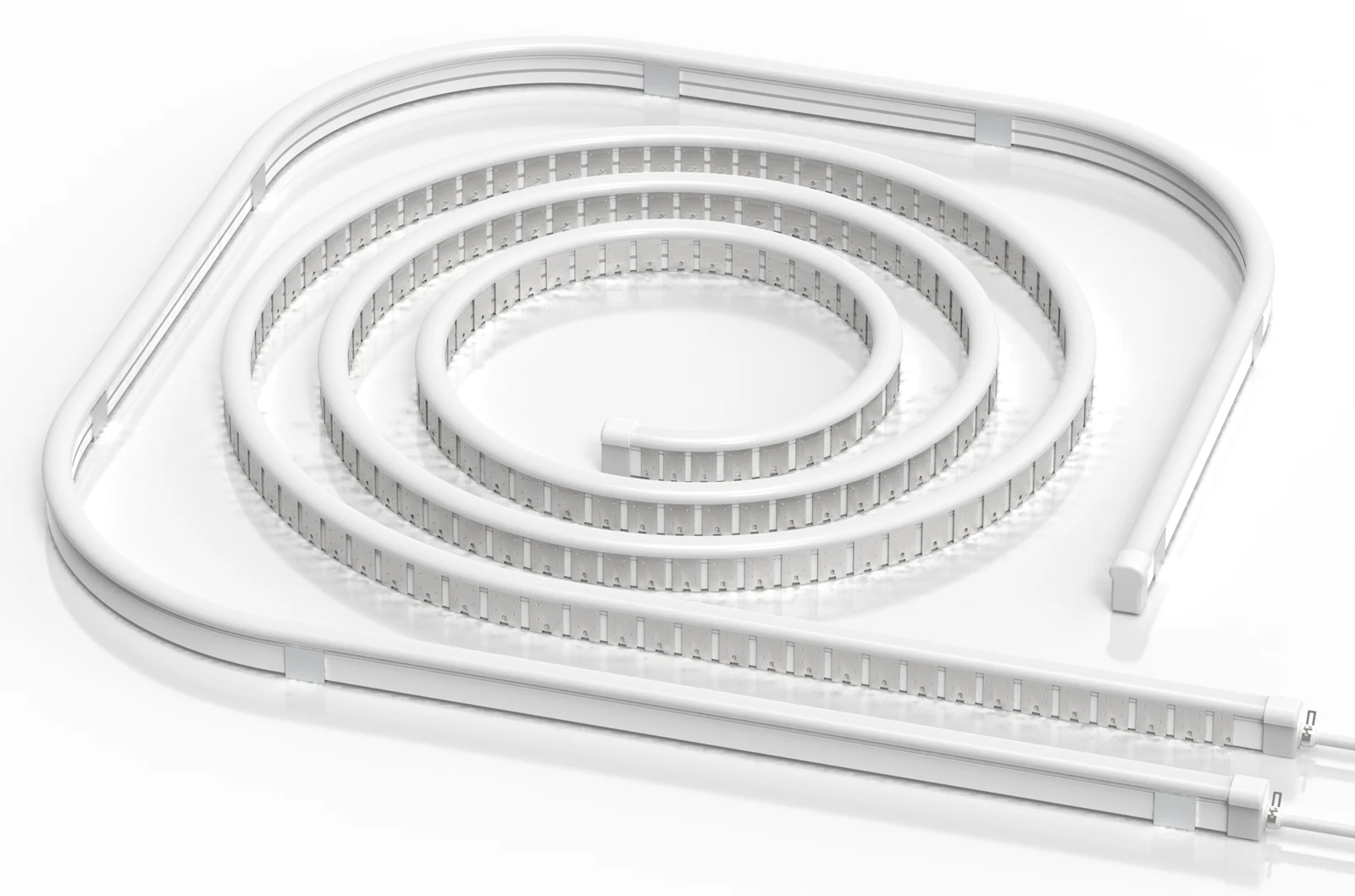 Clear silicone lighting profile with a white emitting surface, coiled on a white background