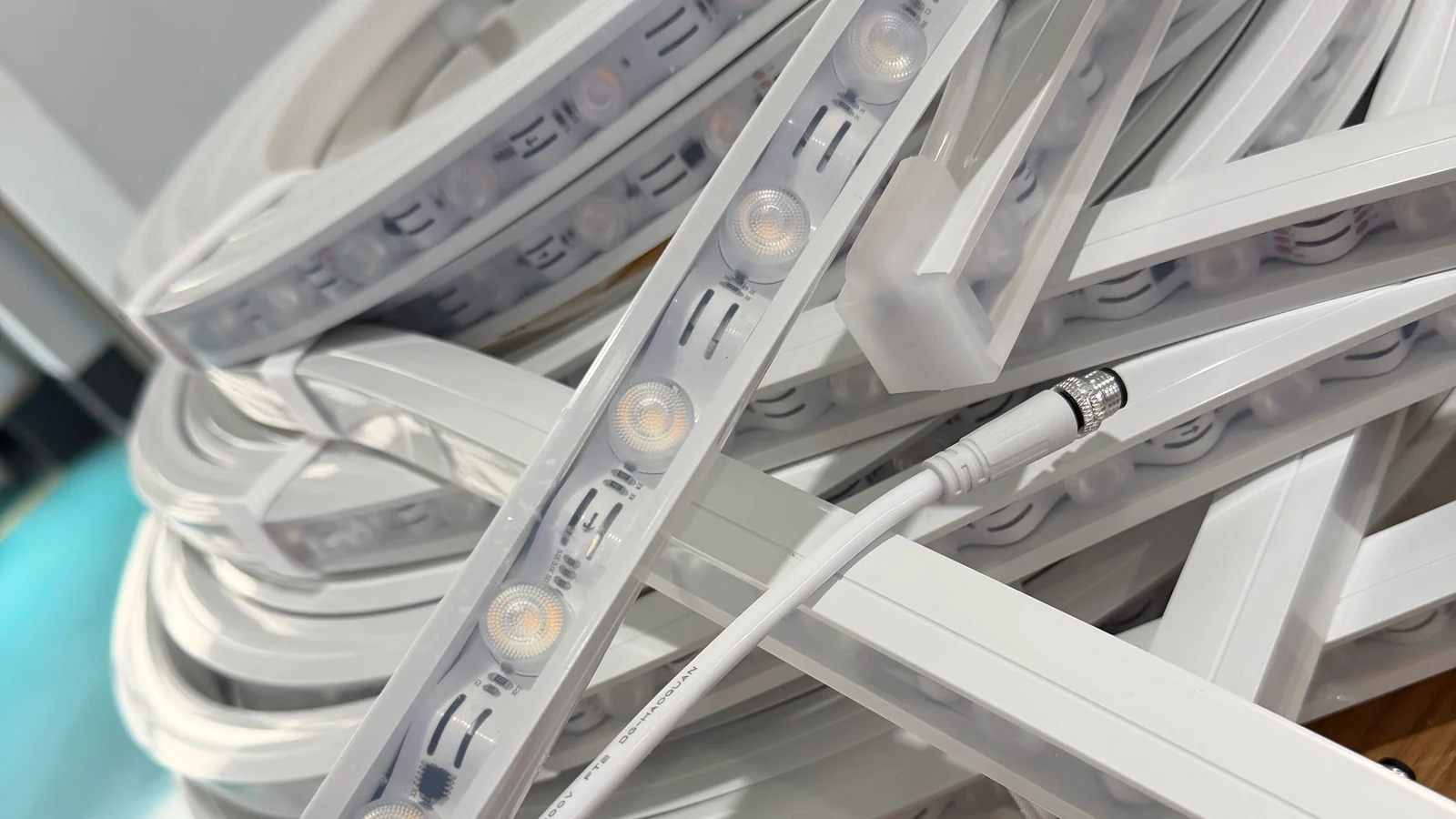 Close view of an LED strip positioned inside a white silicone lighting profile
