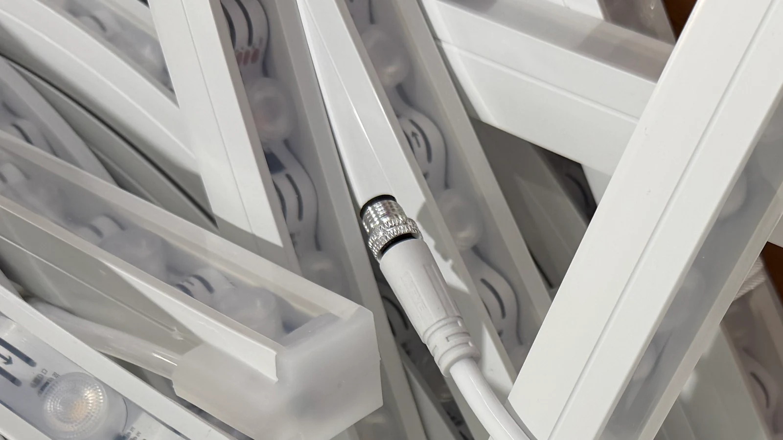 Close-up of a real cable connector on one LED lighting assembly